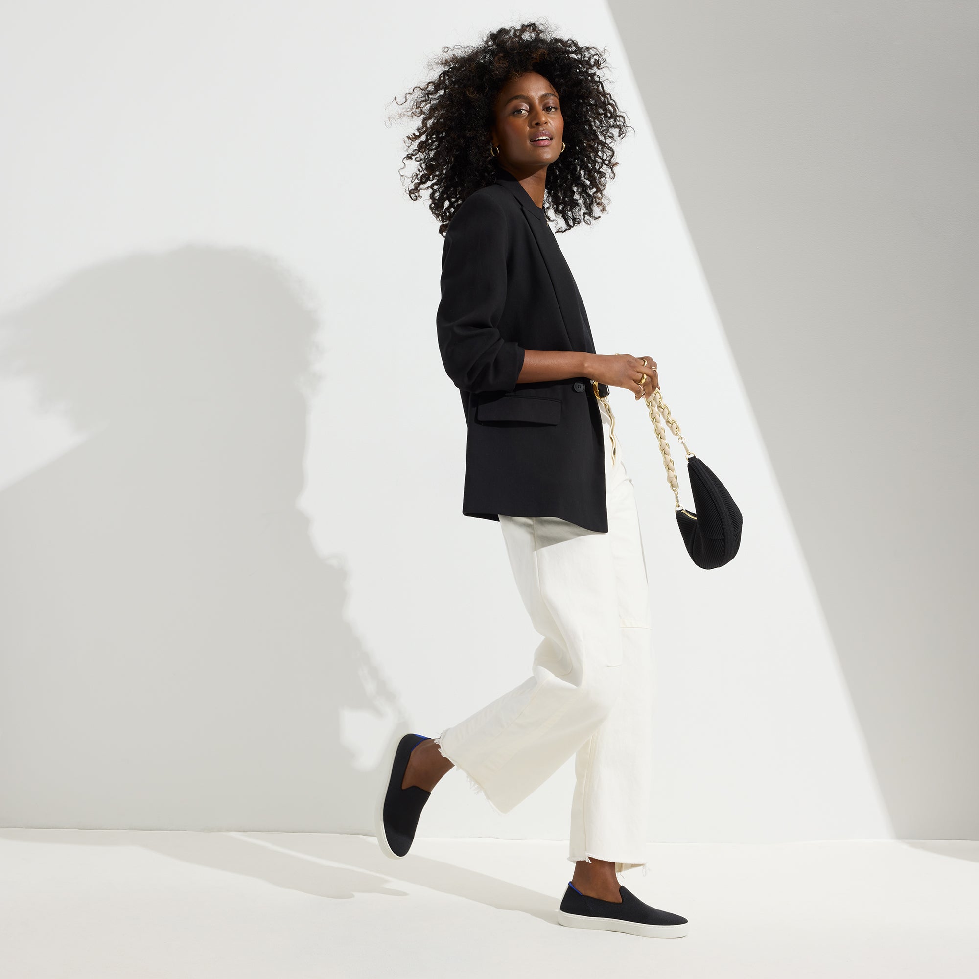 The Original Slip On Sneaker in Black Solid shown on-model at an alternative angle.