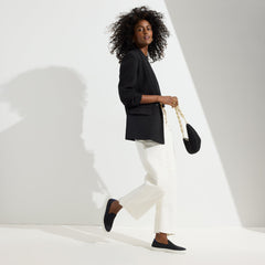 The Original Slip On Sneaker in Black Solid shown on-model at an alternative angle.