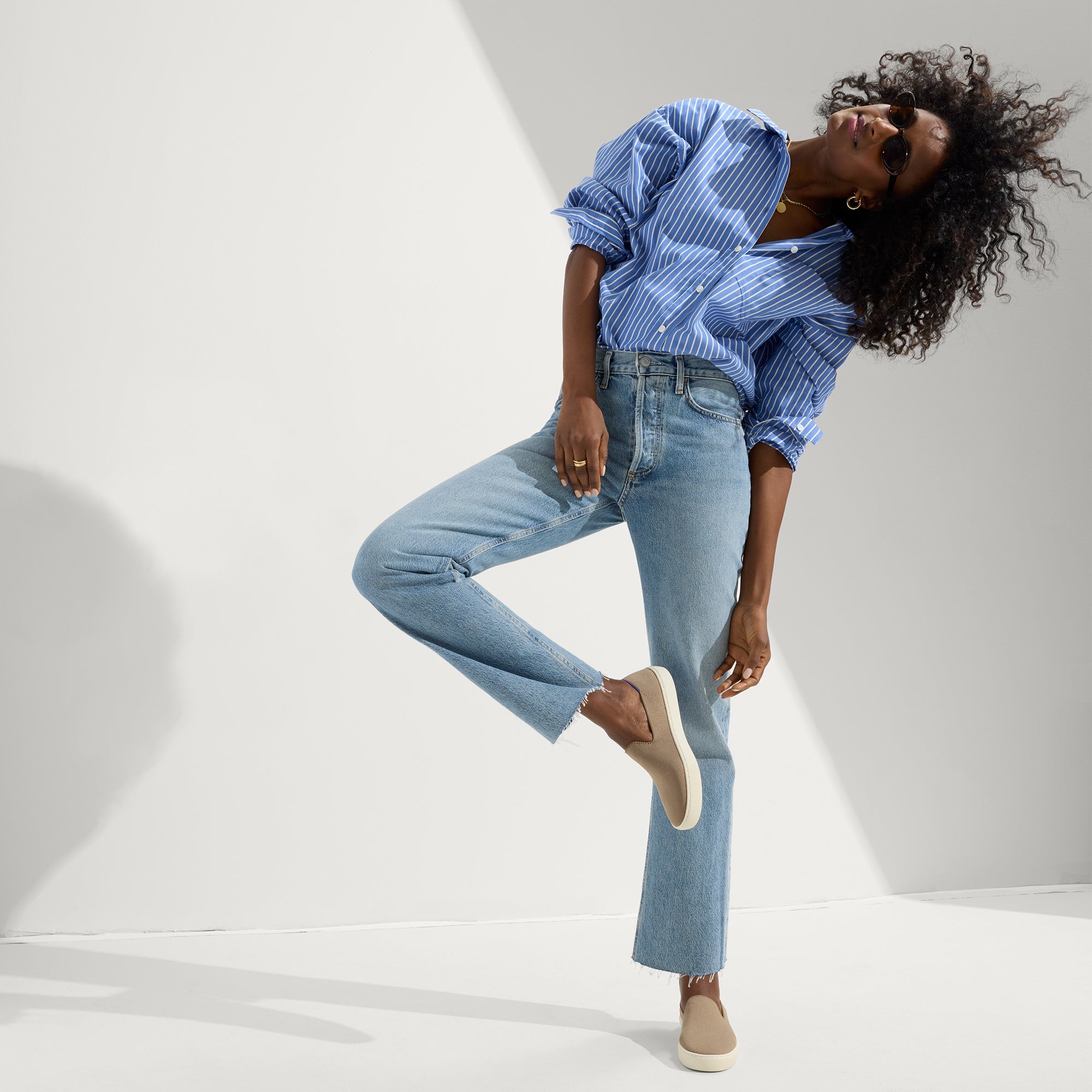 Alternate view of a model wearing The Sneaker in Latte.