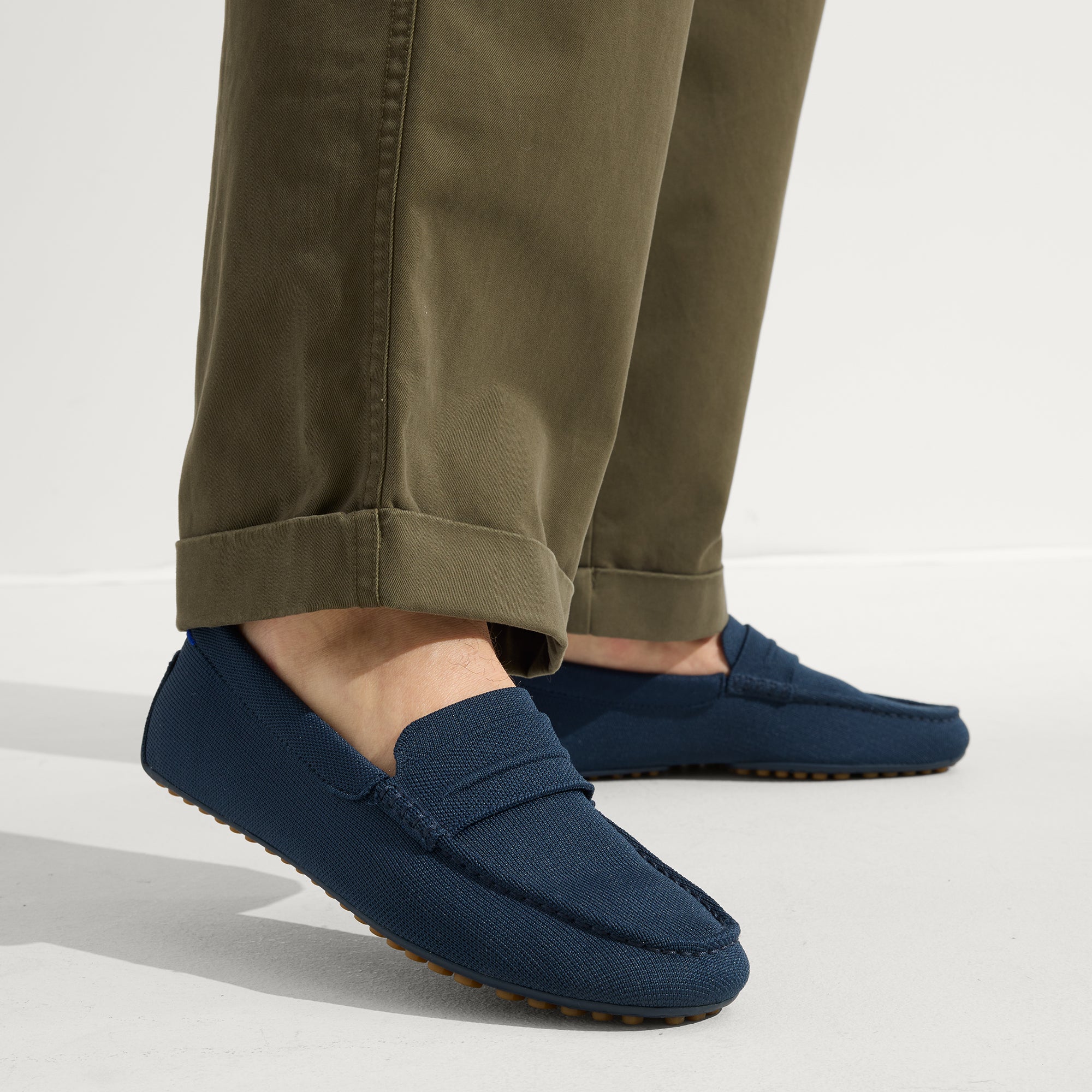 hover | Model wearing The Driving Loafer in Navy.