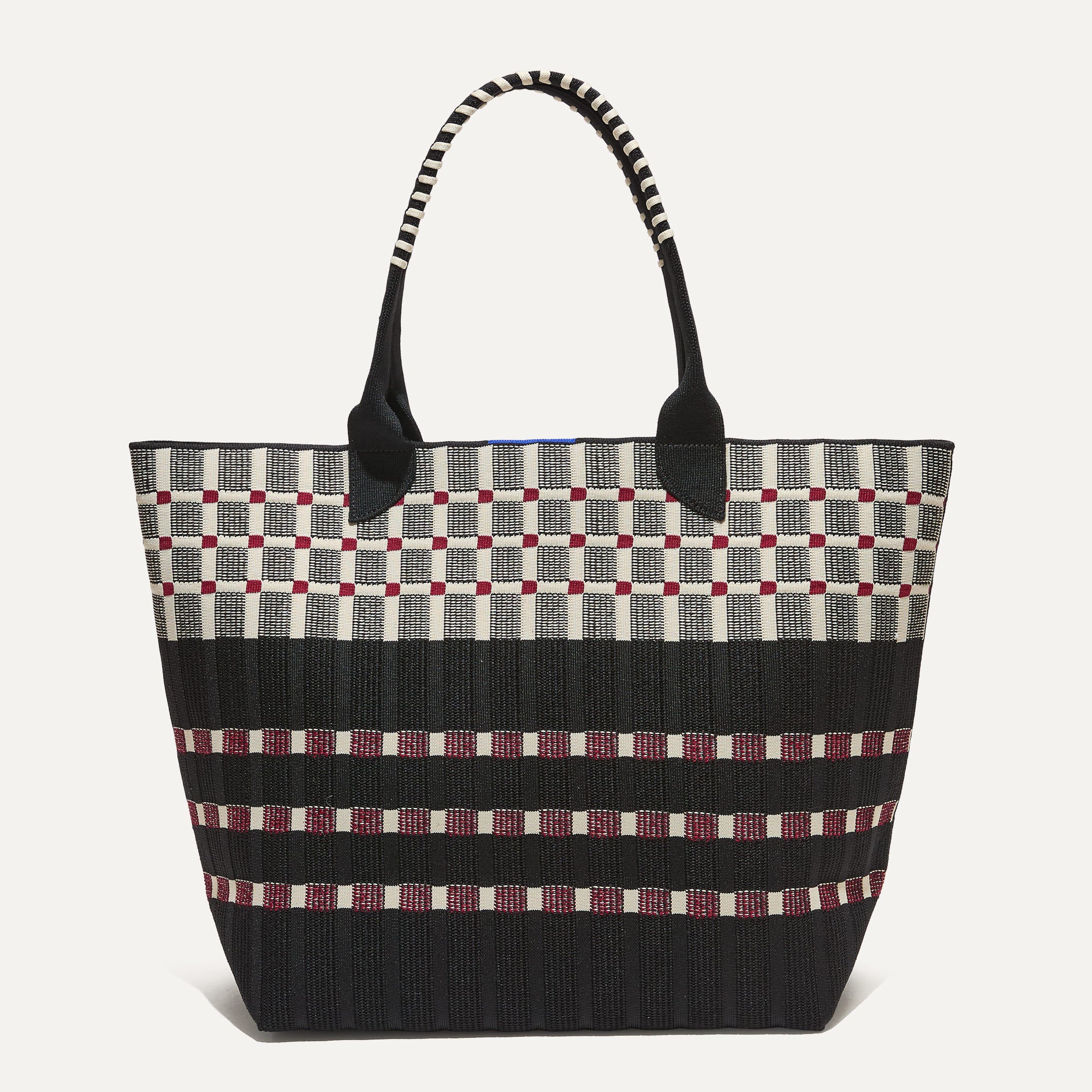 PDP |The Lightweight Tote in Newspaper shown from the front.