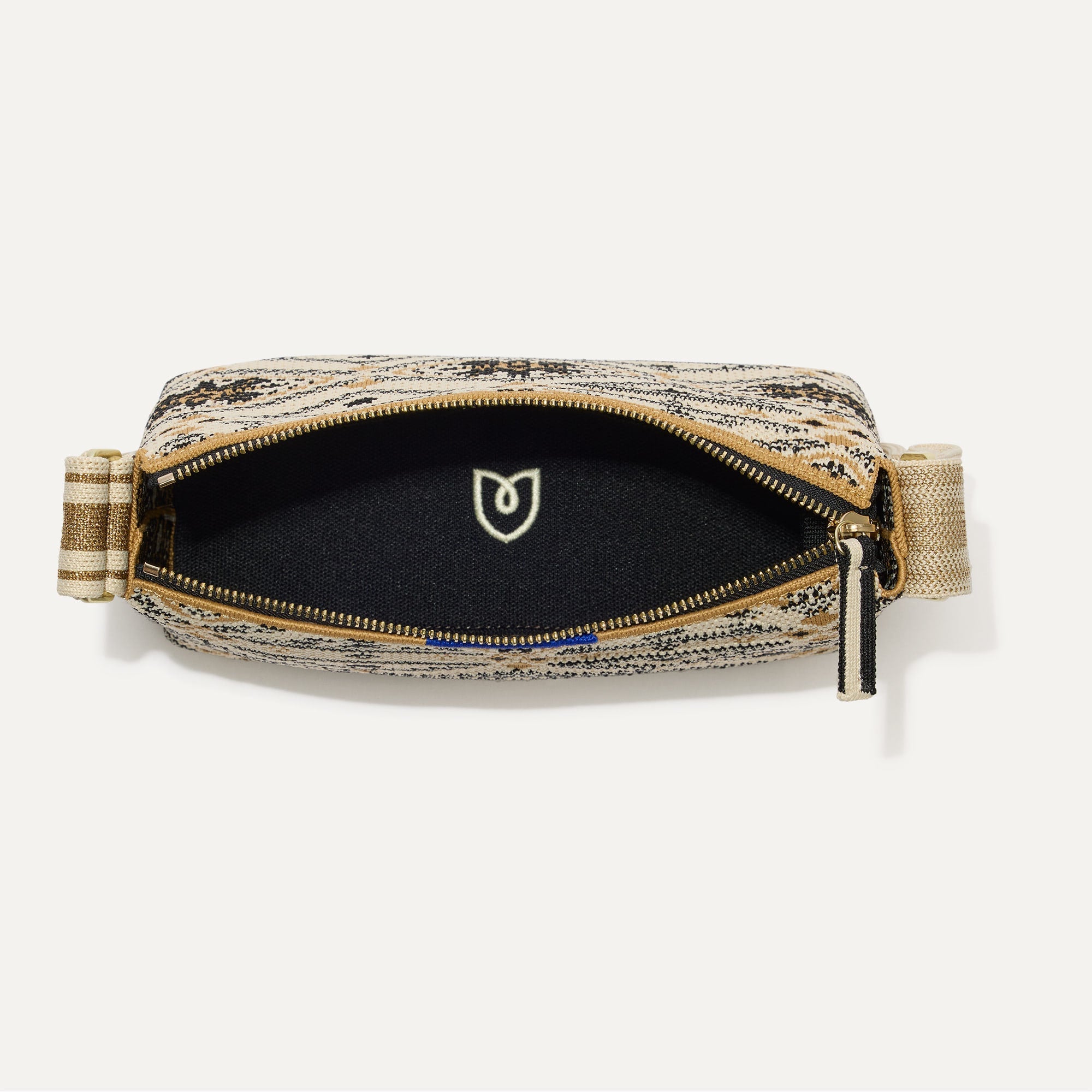 The Casual Crossbody in Desert Mosaic, shown from above, with the interior exposed. 