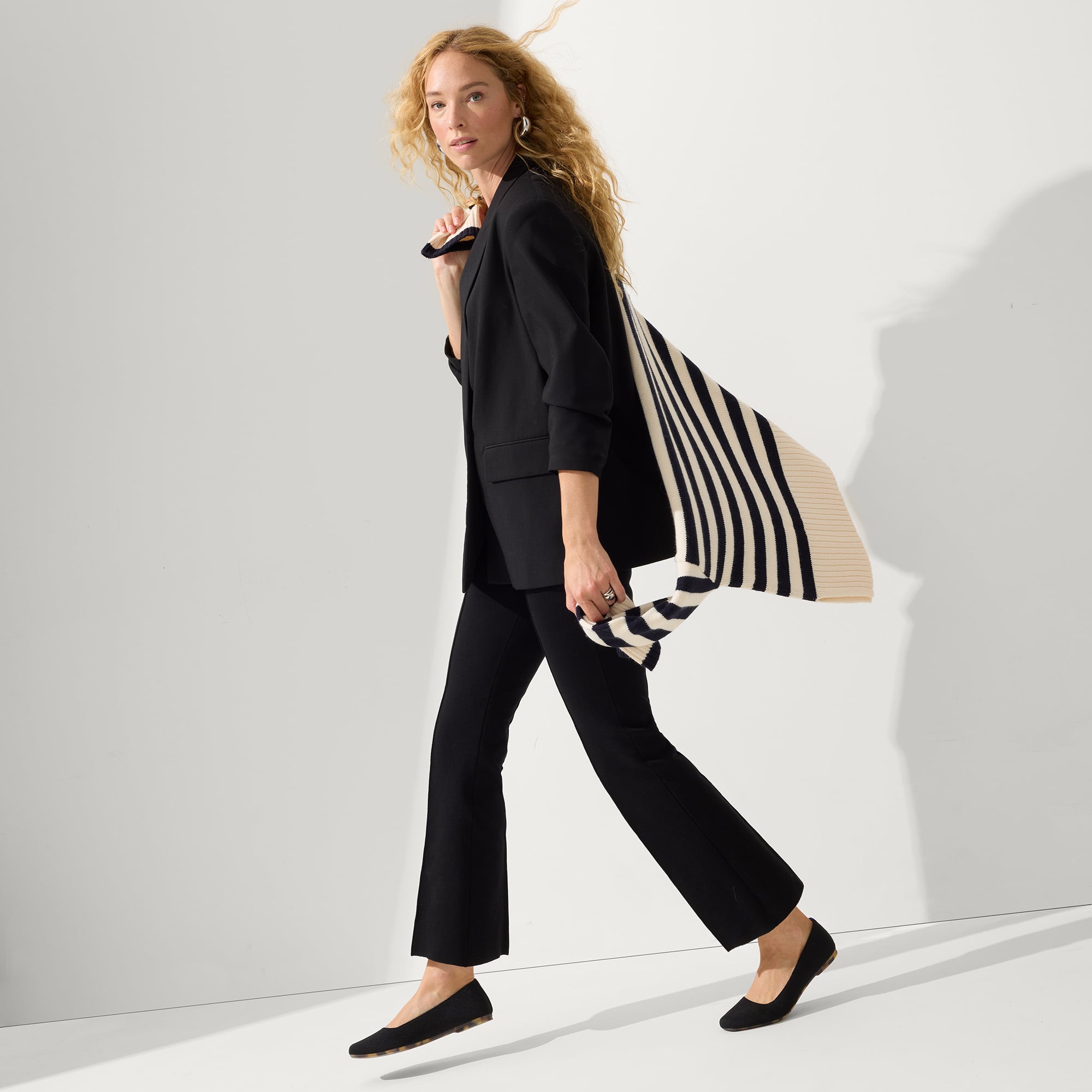 Alternative angle of model wearing The Max Square in Black.