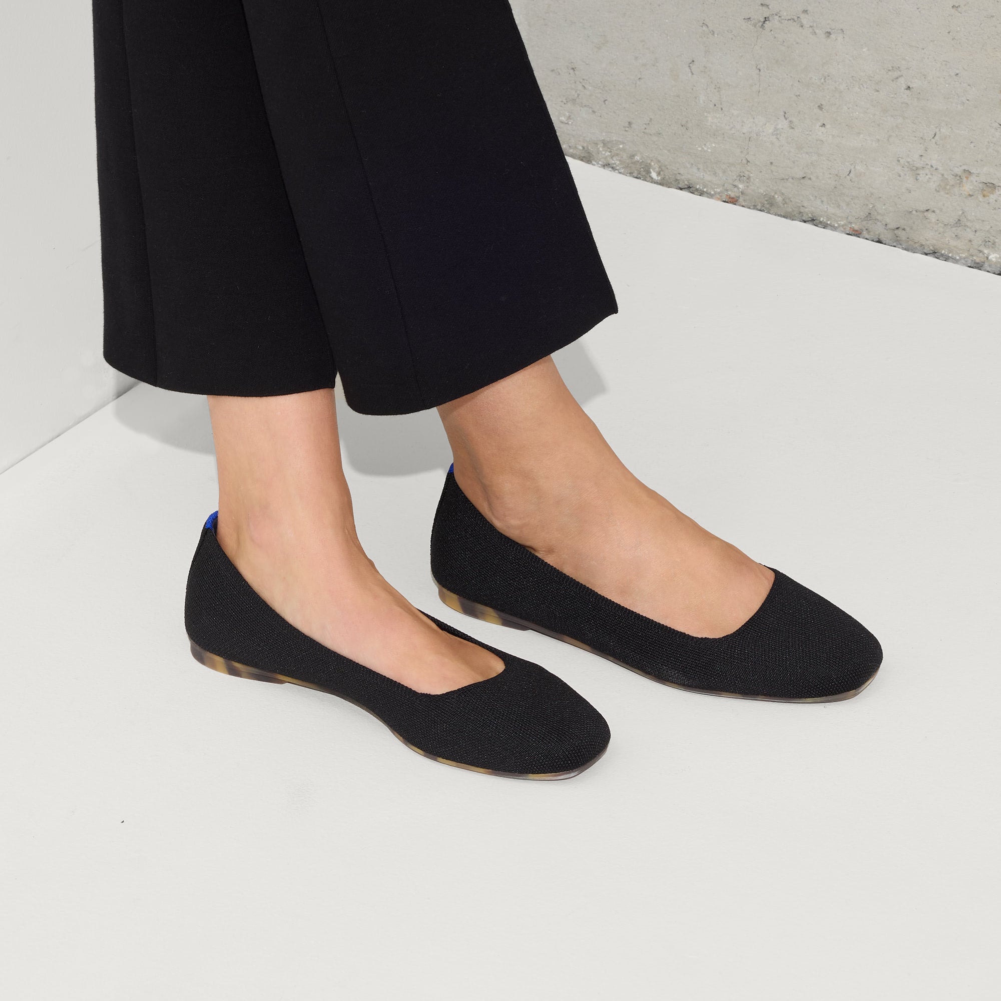 hover | Model wearing The Max Square in Black.
