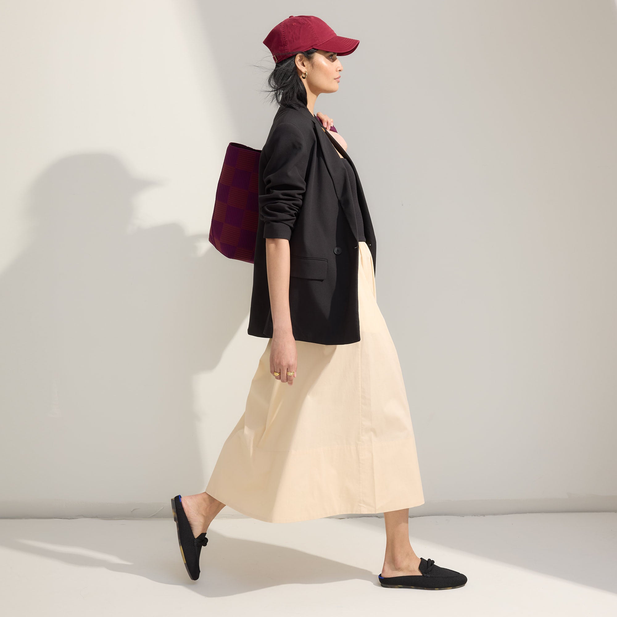 Alternate view of a model wearing The Loafer Mule in Black.