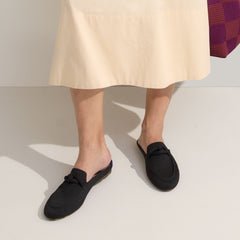 hover | Model wearing The Loafer Mule in Black.