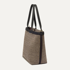 The Lightweight Zip Tote in Cacao Herringbone shown from the side.