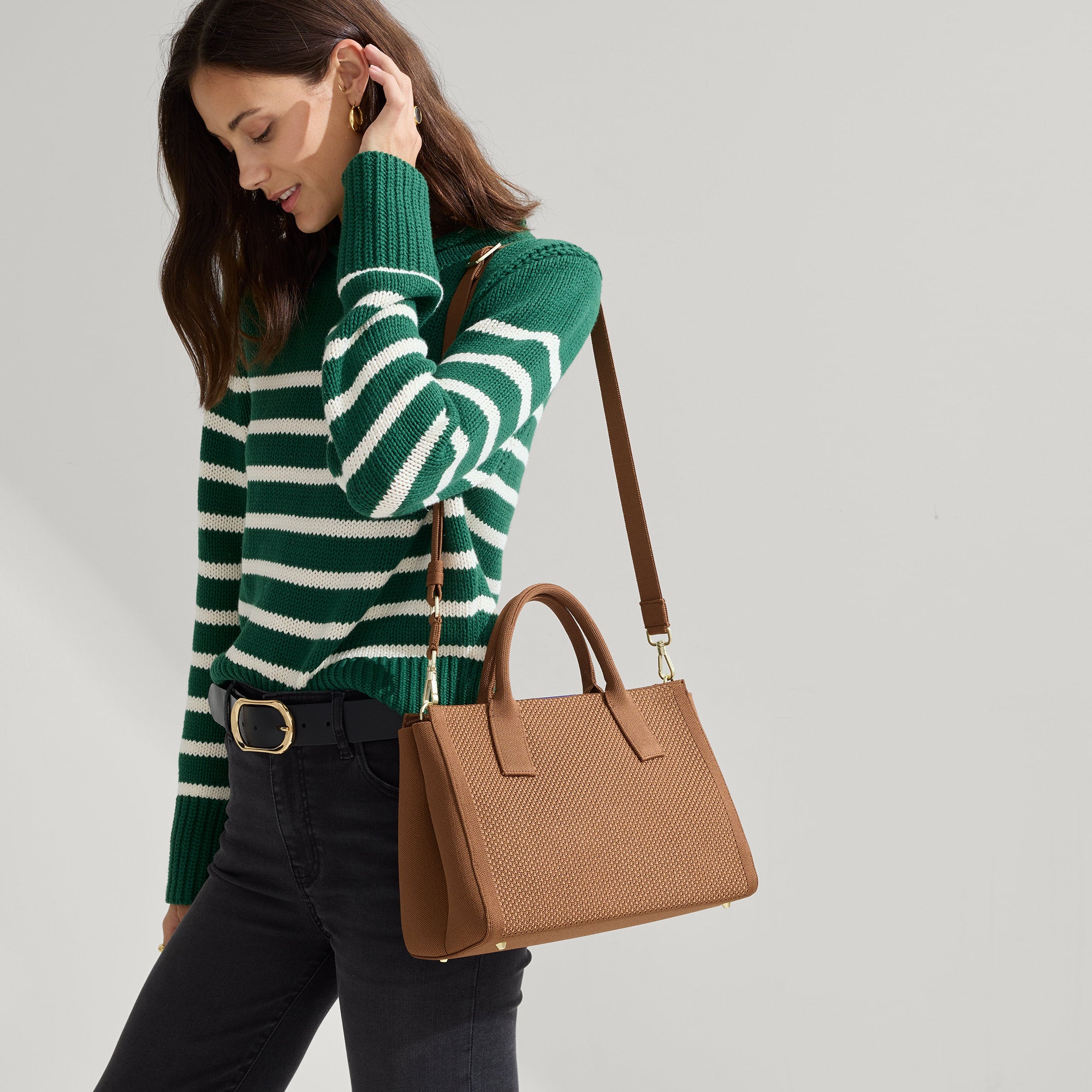 hover | The Classic Handbag in Sierra Brown being carried by a model.