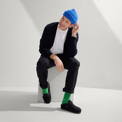 Alternate view of a model wearing The Men's Clog in Soft Black.