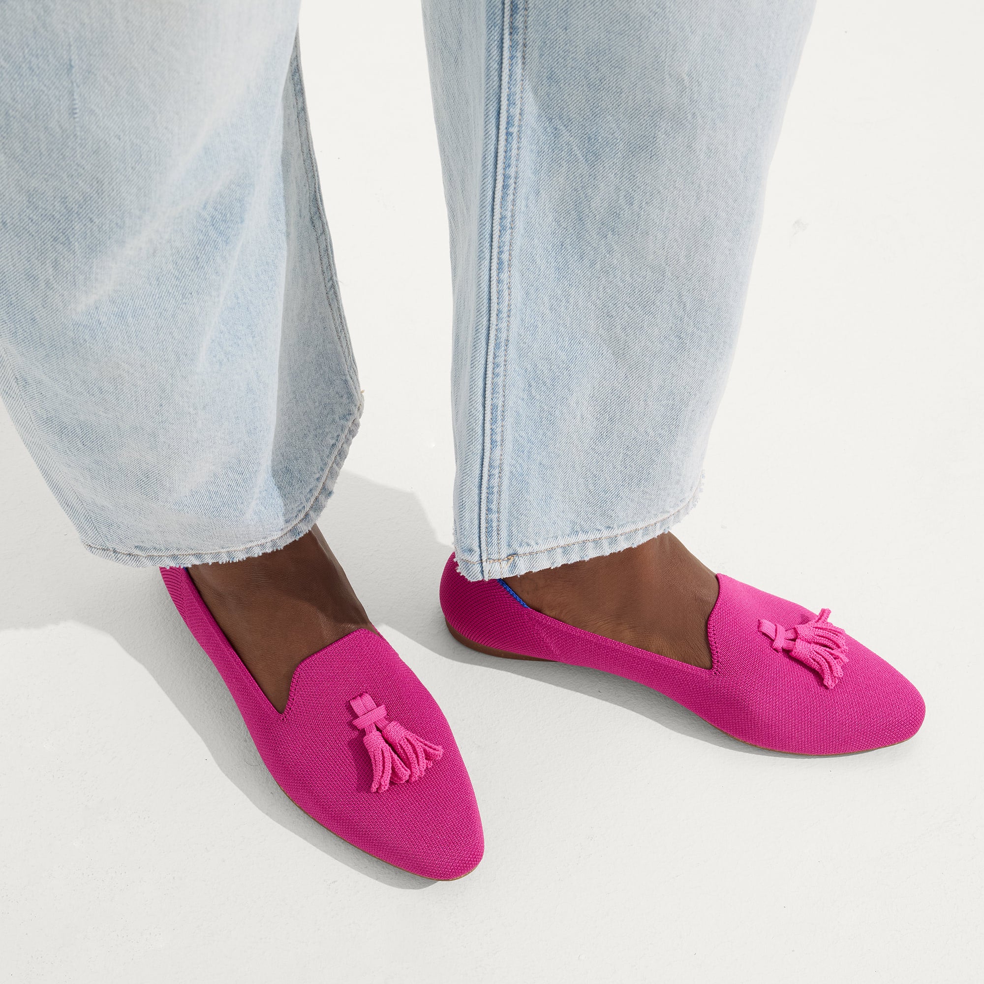 hover | Model wearing The Almond Tassel Loafer in Pink Bramble.