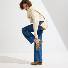Alternate view of a model wearing The Classic Clog in Black.