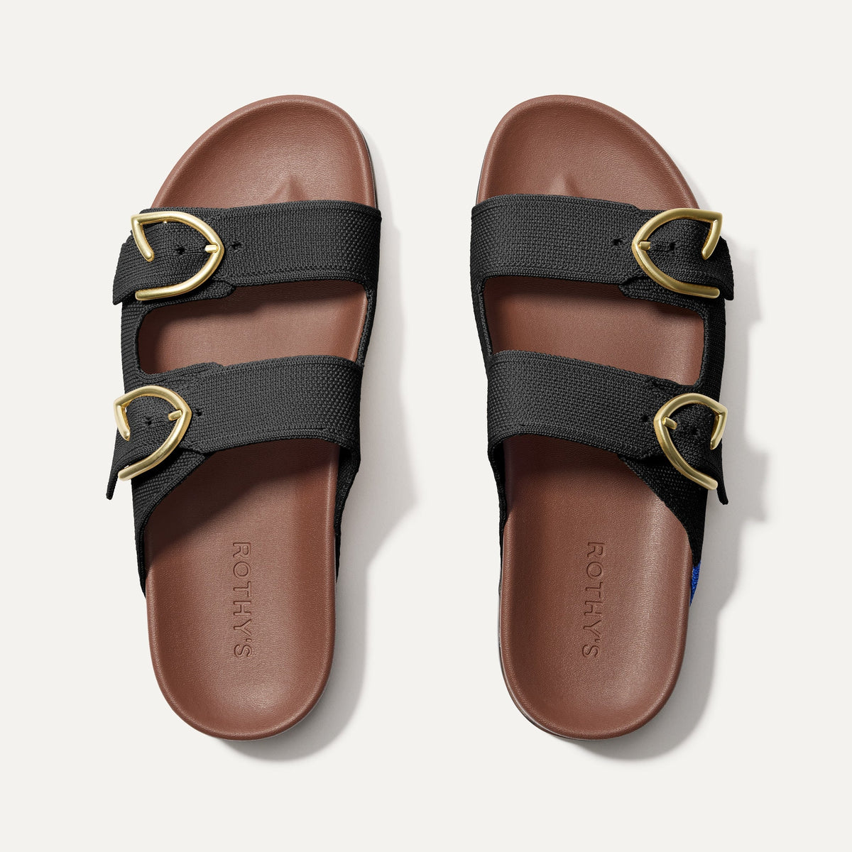 The Buckle Slide Sandal in Black shown from the top.