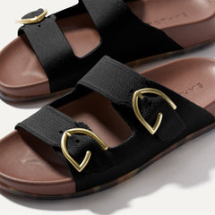 Close up of buckle closer of The Buckle Slide Sandal in Black.
