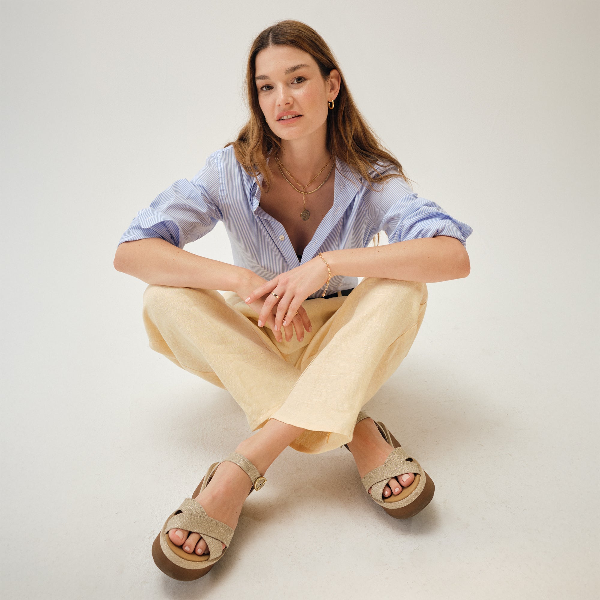 Alternate view of a model wearing The Criss-Cross Lightweight Wedge Sandal in Aurora.