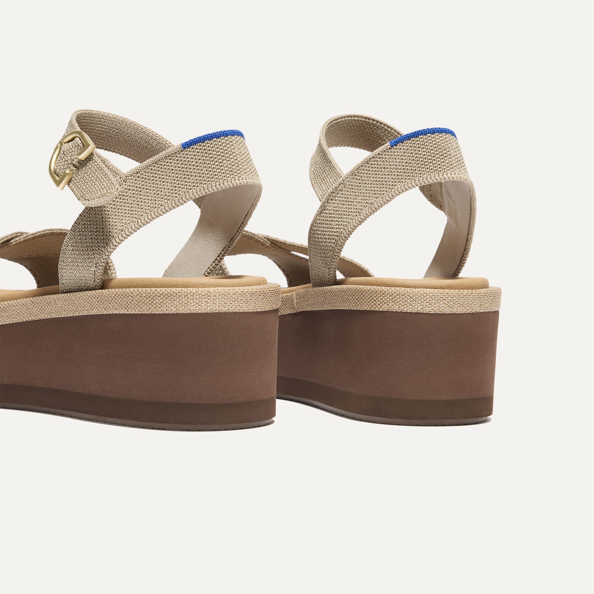 Close up of the heel of The Criss-Cross Lightweight Wedge Sandal in Aurora, with Rothy's signature blue halo.