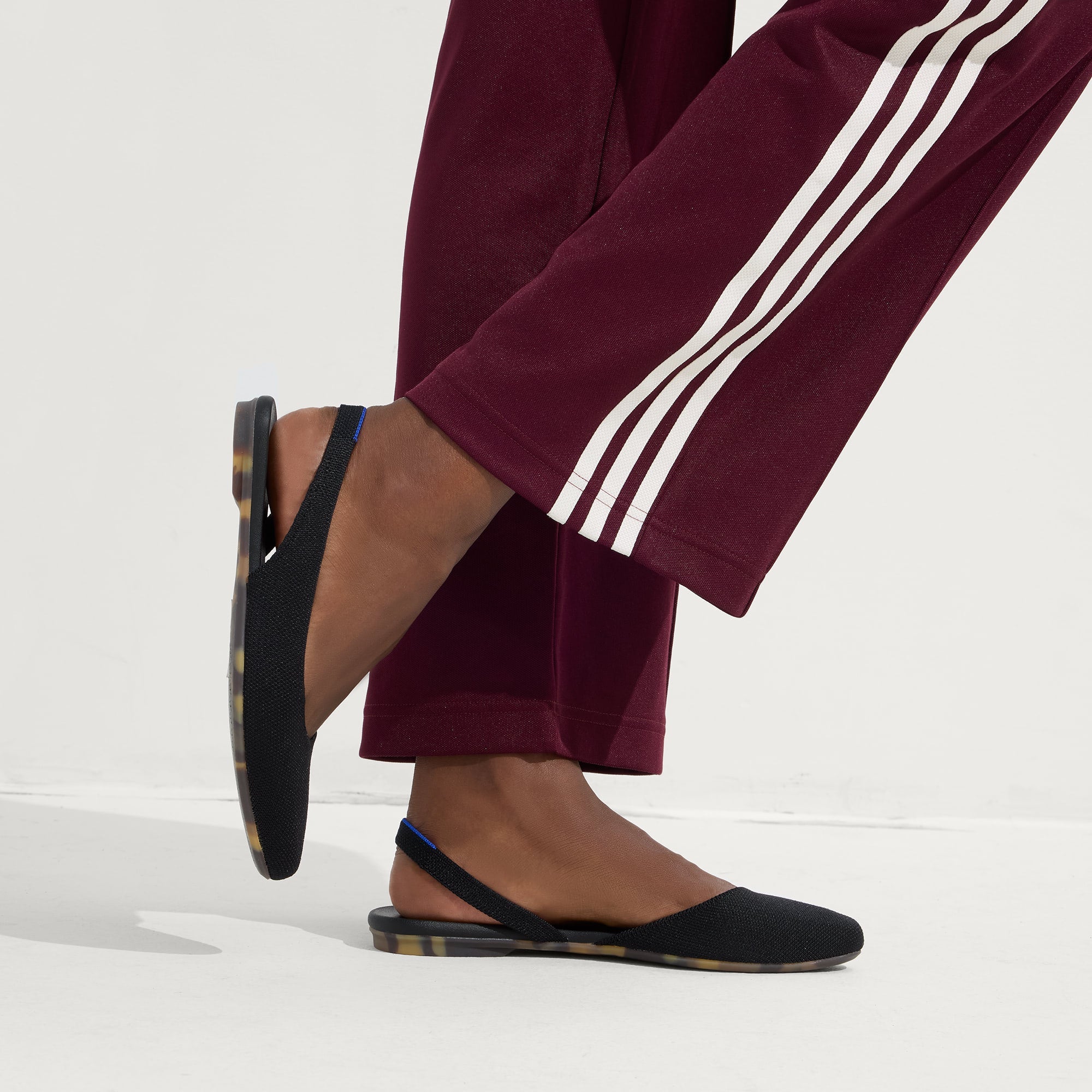 hover | Model wearing The Almond Slingback in Black.