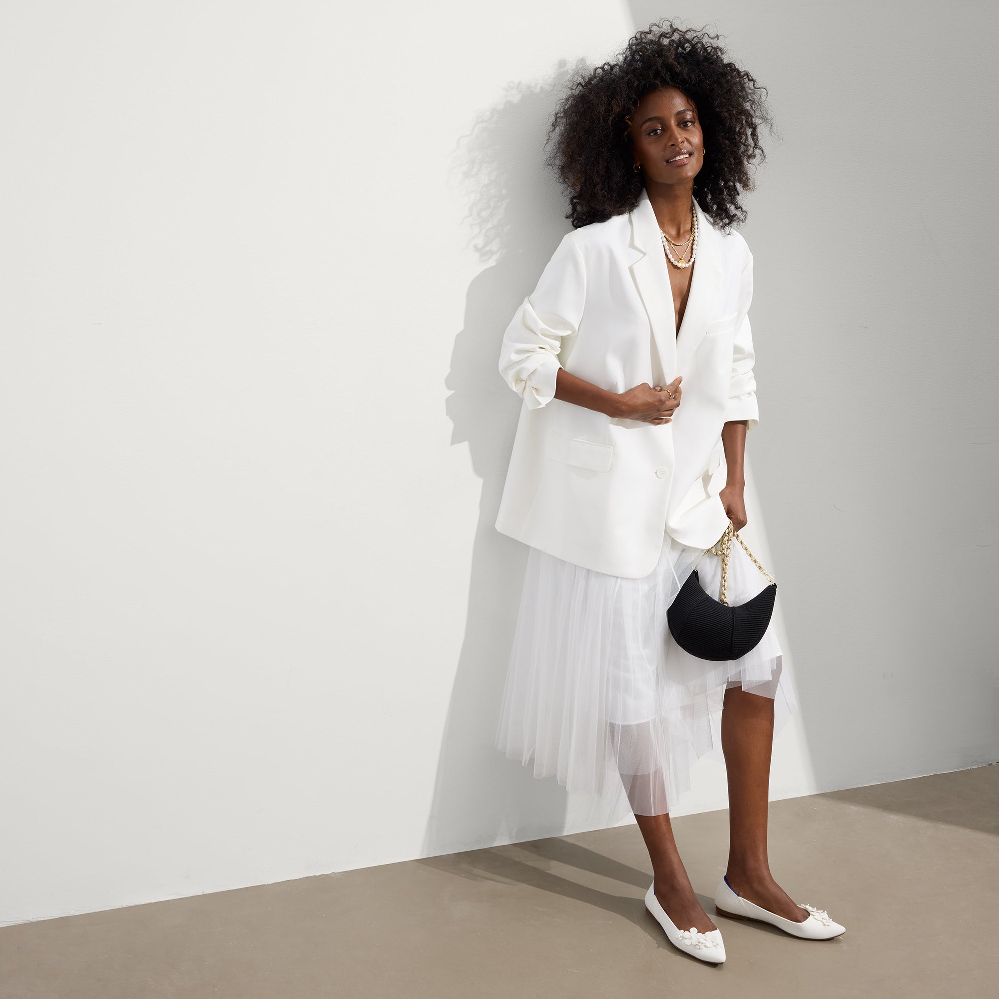 Alternate view of a model wearing The Petal Point II in White.