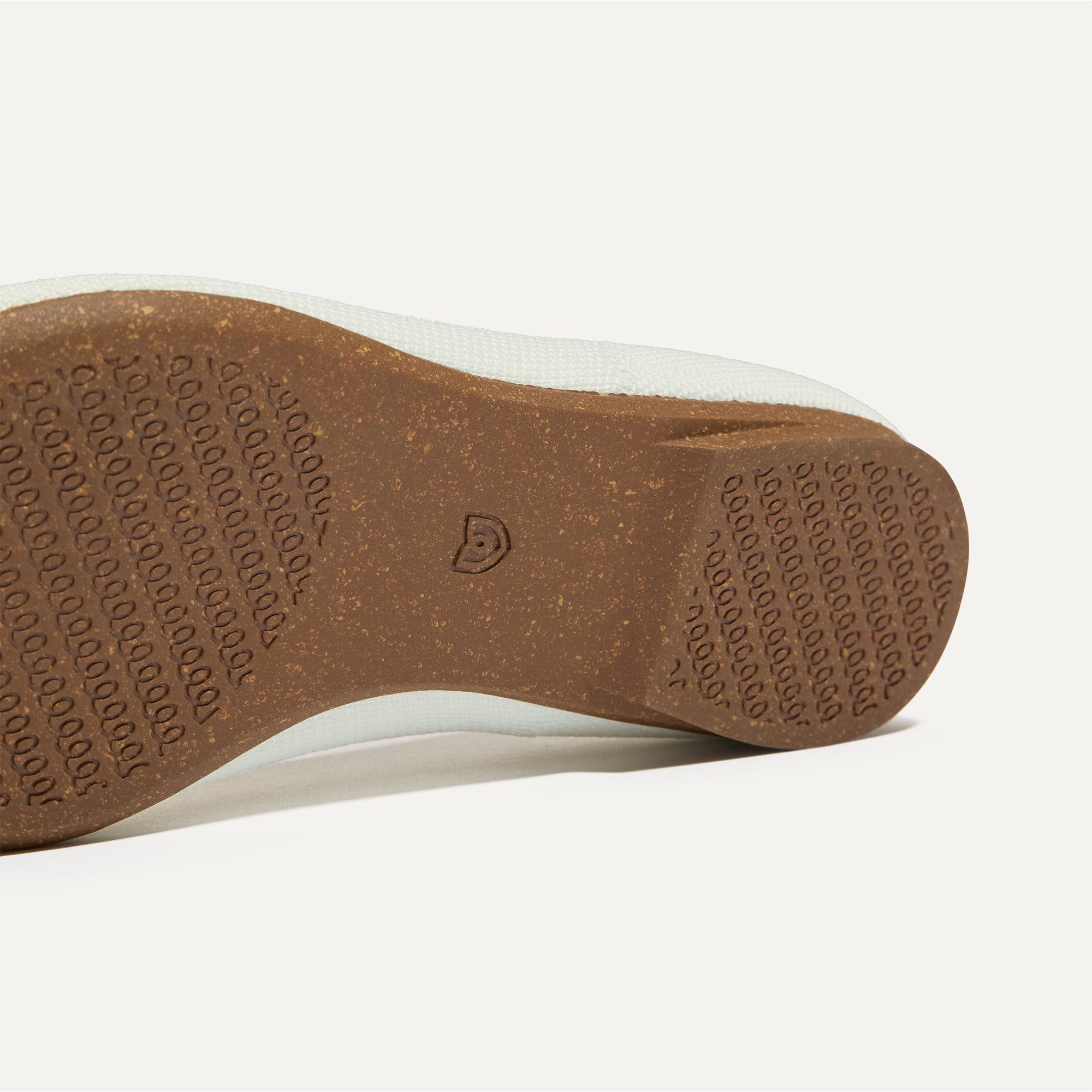 The sole of The Petal Point II in White shown in diagonal view.