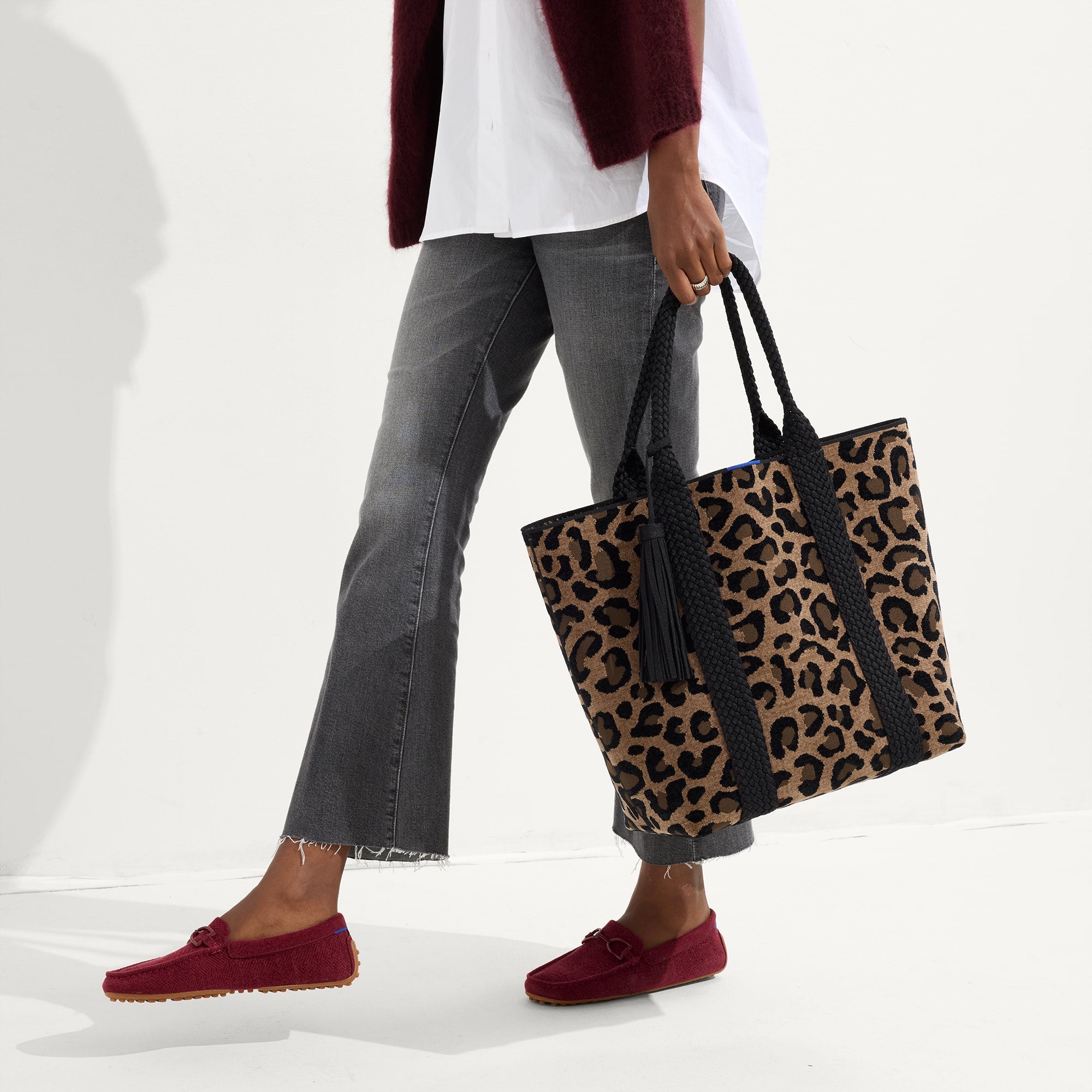 Model holding The Revelvet Lightweight Tote in Revlvet Cat.