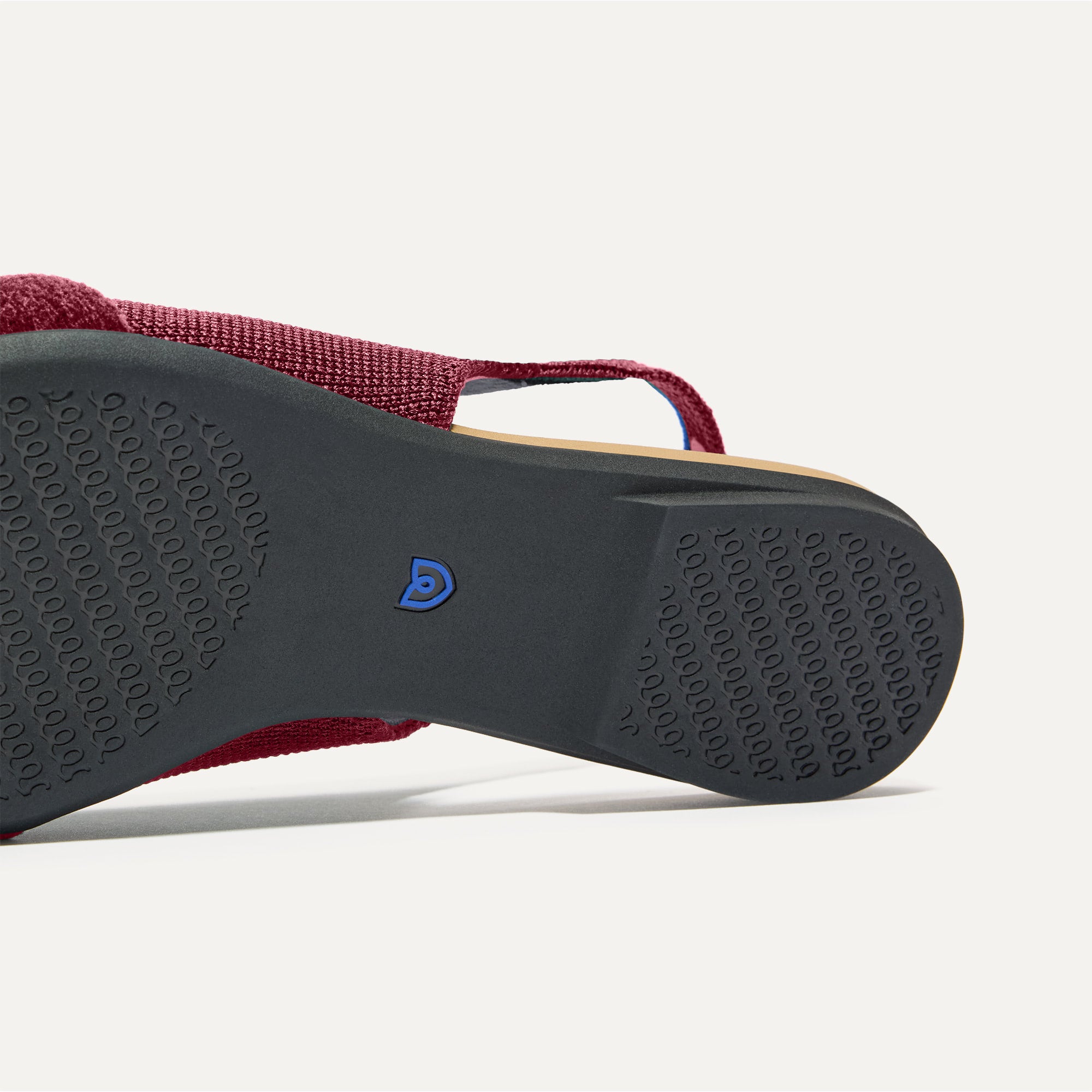Close up of the outsole of The Twist Point Slingback in Cabernet.