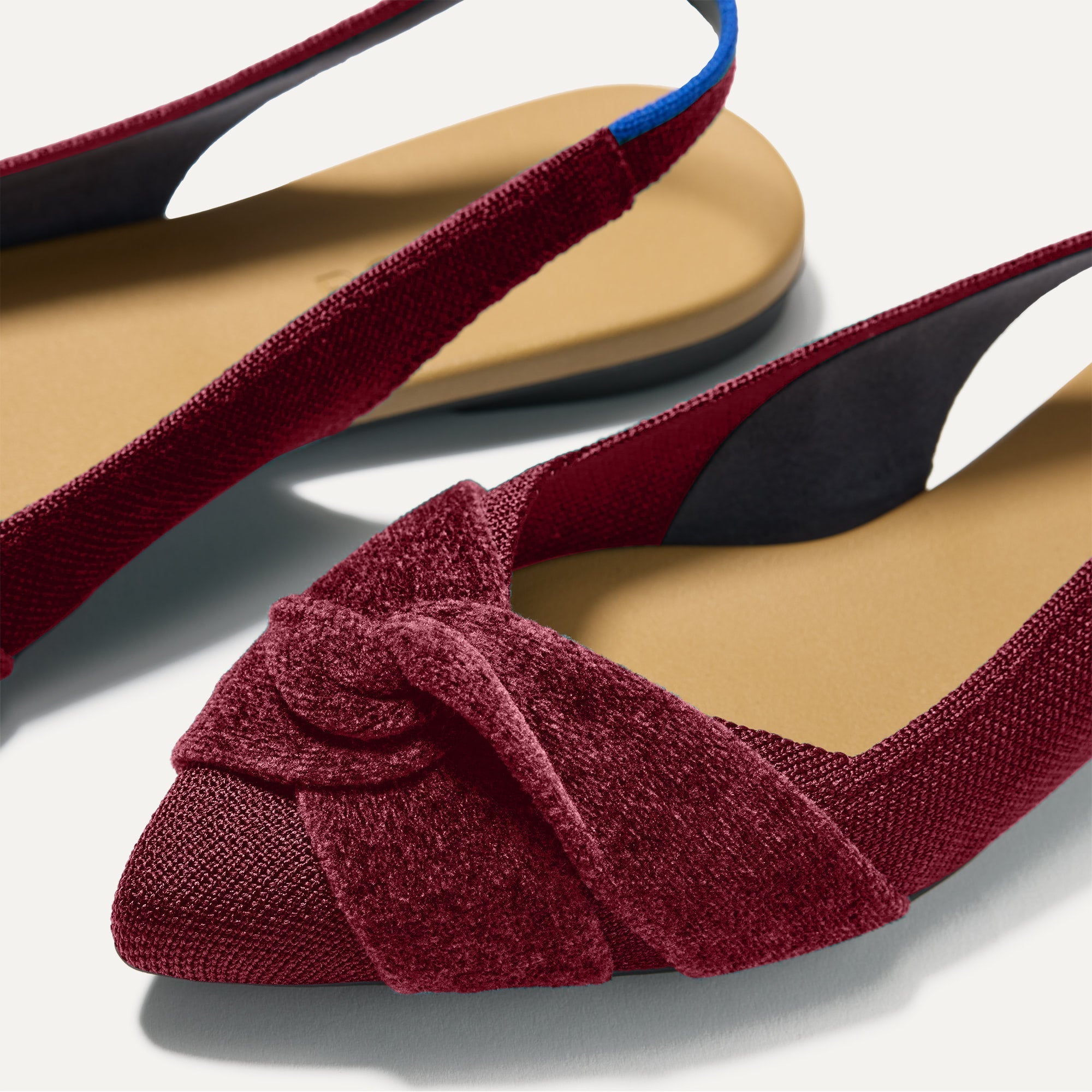 Close up of the toe and twist detail on The Twist Point Slingback in Cabernet.